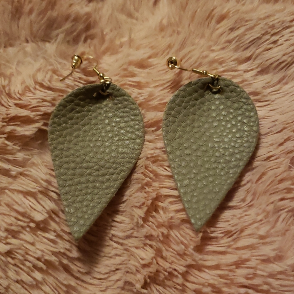 Brand new!! Leather feather earrings